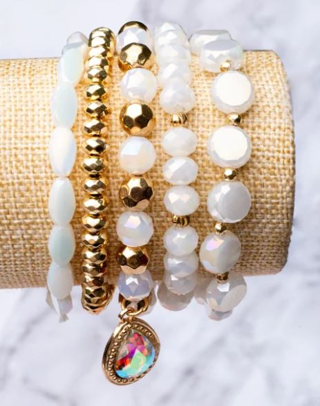 bracelet_set ladies_bling_fashion timeless_accessory trendy_accessories french_kiss_bracelet_set gift_ideas gifts_for_her glam_finds fashion_trends fashion_accessories white_and_gold_bracelet holographic_charm_bracelet birthday_gift