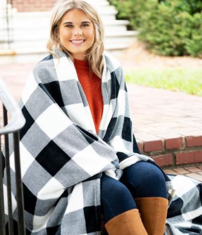 Stay cozy with our plush polyester buffalo plaid blanket, measuring 80 in x 50 in. Perfect for chilly nights, this blanket adds rustic charm to your home decor.