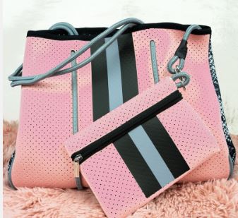 Get style and durability with this versatile neoprene tote, perfect for any season! Features include a magnetic snap closure, removable hard bottom liner, and woven corded rope accents. Plus, it comes with a removable zip pouch and is washable with mild soap.