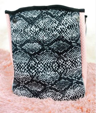 Get the perfect blend of luxury, durability, and functionality with this neoprene tote bag. Featuring perforated holes in the front, magnetic snap closure, and a removable hard bottom liner, this lightweight and stain-resistant bag is ideal for any occasion. With a phantom shape and woven corded rope accents, it comes with double handles and a removable strap. Additionally, it includes a removable zip pouch for added convenience. Washable with mild soap, this tote bag is perfect for year-round use