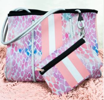 This neoprene tote is the ultimate combination of luxury and functionality. Made of durable, stain-resistant neoprene with woven corded rope accents, this lightweight bag features a magnetic snap closure, removable hard bottom liner, and a convenient zip pouch. Use it year-round and wash it easily with mild soap. Perfect for trendy and stylish people who need a versatile and practical bag for any occasion!