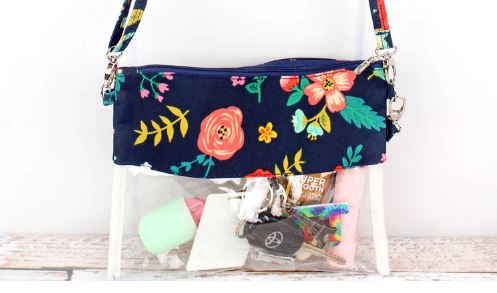 Stay organized and stylish with this clear bag that can be used as a crossbody, wristlet, or clutch. Perfect for school, work, travel, shopping, and stadiums where clear bags are required. Constructed with soft canvas and heavy-duty clear plastic, this bag features a zip top closure, detachable wristlet strap, and adjustable shoulder strap with a max. 24" drop. Measuring 7.5" wide x 9.5" tall, it keeps your necessities visible and within easy reach while on the go!